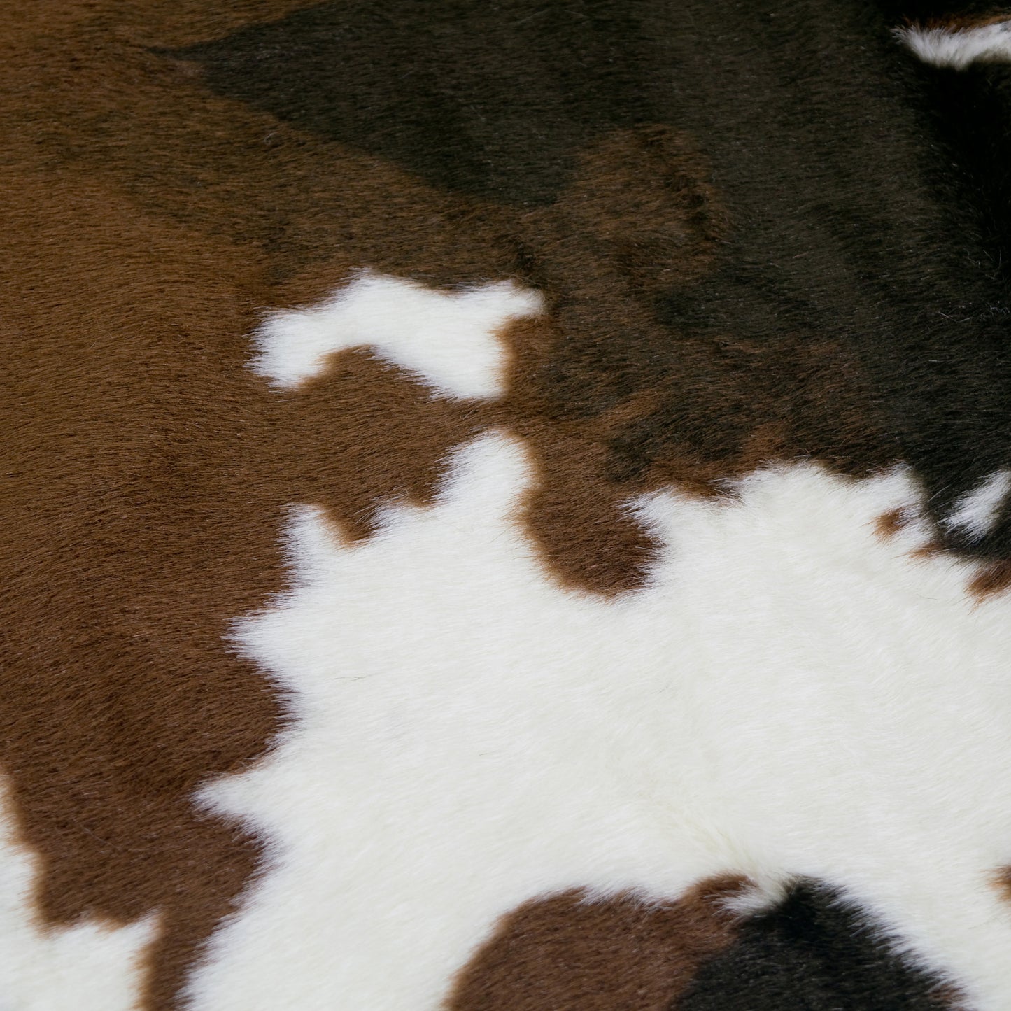 Alecia Faux Cowhide Brown and White Area Rug 68 inch by 50 inch
